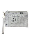 CHRISTIAN DIOR
X DANIEL ARSHAM Grained Calfskin Newspaper Wristlet White